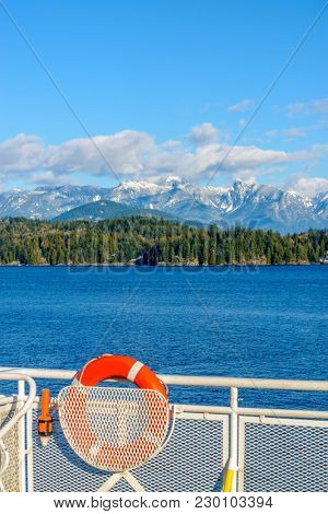 Fantastic view over ocean, snow mountain and rocks at Sechelt inlet in Vancouver, Canada.