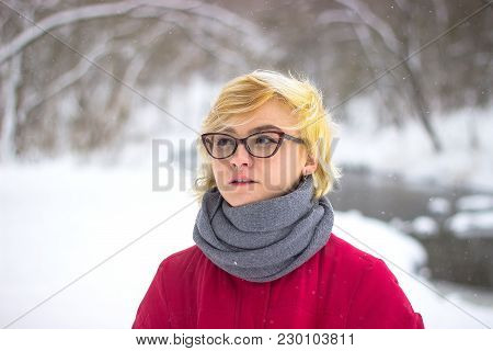 Soft Portrait Of Odd Lonely Girl Sitting In Winter Snowy Forest. Friendless Female Person With Sad E