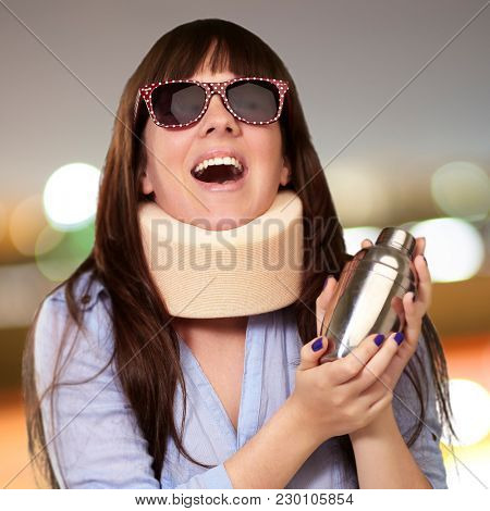 Woman Wearing Neckbrace Holding A Shaker, Outdoor