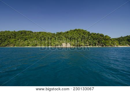 Scenic Sea View Of The Kapas Island At Terengganu, Malaysia. Clear Sea Water And Blue Sky Background