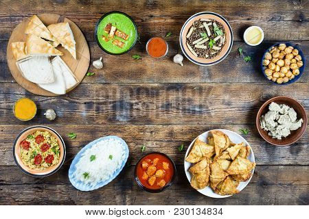Various Dishes Of Pakistani And Bangladeshi Cuisine On A Wooden Table Banner. Copy Space. Concept: E