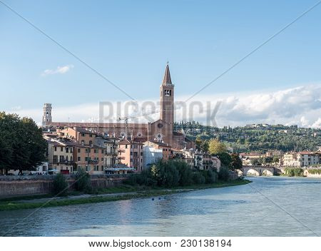 View Of Verona. Ponte Pietra, Once Known As The Pons Marmoreus. It Is The Roman Arch Bridge Crossing
