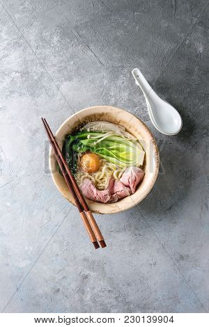 Asian Dish Udon Noodles With Egg Yolk, Sesame, Mushrooms, Boc Choy, Sliced Sous Vide Cooked Meat Ser