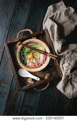 Asian Dish Udon Noodles With Egg Yolk, Sesame, Mushrooms, Boc Choy, Sliced Sous Vide Cooked Meat Ser
