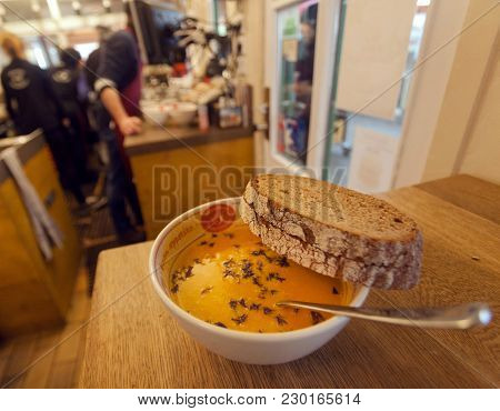 Munich, Germany - November 16, 2017: Hot Plate Of Soup And Bread Inside A Street-food Cafe With Loca