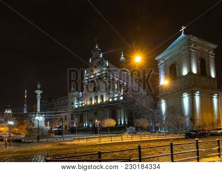 Night Winter Lviv City, Ukraine. Bernardine Church And Monastery Of St. Andrew (17th Century) And Mo