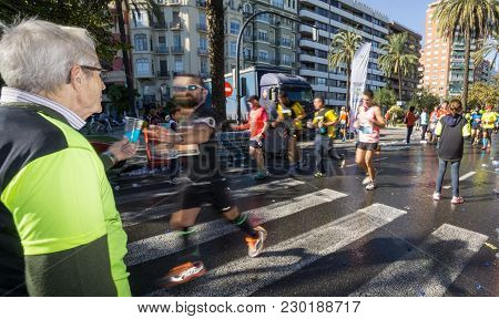Valencia - November 16: Unidentified Collaborator Helps Runners In Valencias Marathon On November 16