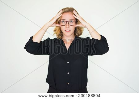 Pensive Pretty Lady Trying To Concentrate And Calm Down. Serious Attractive Young Woman Touching Hea