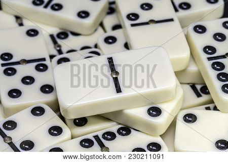 Dominoes Is A Family Of Board Games , The Game Is Played With Dominoes Tiles Which Are In The Photo 