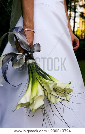 Bride Holding Her Wedding Bouquet By Her Side