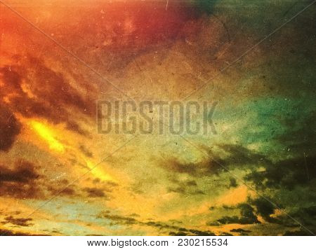 Apocalyptic Grunge Sunset Sky And Clouds Background. Dusty Scratched Texture.