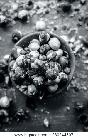 Close Up Of Baked Or Roasted Chickpea/channa Or Dalia In A Bowl On A Blue Surface.