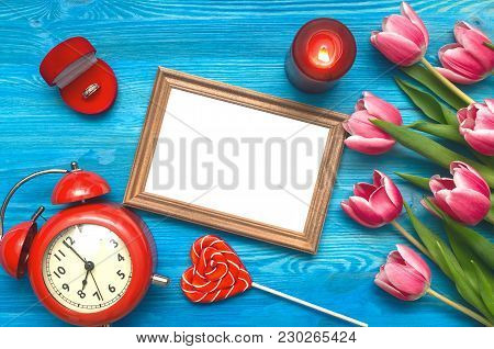 Tulip Flowers Wedding Ring In A Gift Present Box And Empty Photo Frame Of A Loved One Copy Space On 