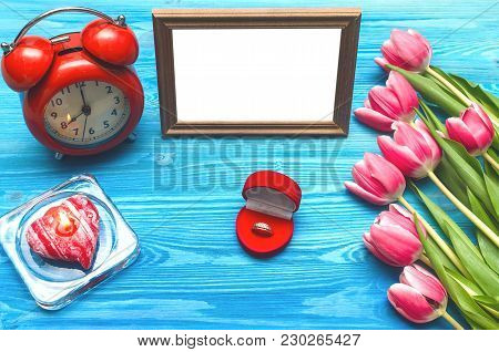 Tulip Flowers Wedding Ring In A Gift Present Box And Empty Photo Frame Of A Loved One Copy Space On 