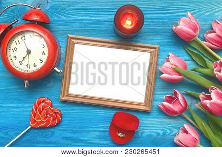 Tulip Flowers Wedding Ring In A Gift Present Box And Empty Photo Frame Of A Loved One Copy Space On 