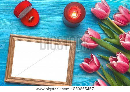 Tulip Flowers Wedding Ring In A Gift Present Box And Empty Photo Frame Of A Loved One Copy Space On 