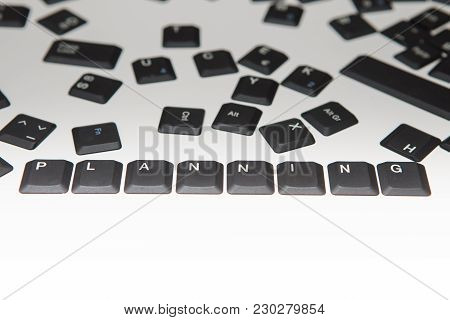 Loose Scattered Alphanumeric And Function Key Covers From A Laptop Computer Keyboard With The Word P