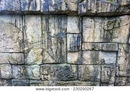 Old Boulder Moss Wall Background With Multiple Toned Rocks