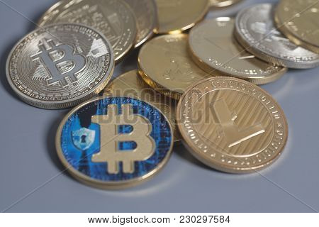 Litecoin, Ethereum Altcoin And Bitcoins Cryptocurrency Coins On A Gray Background