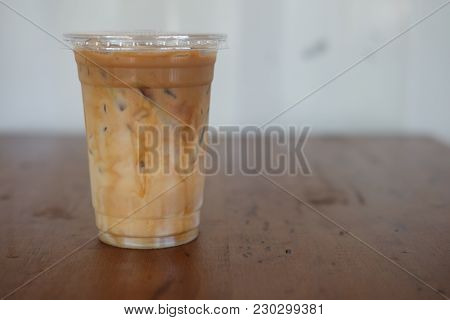 Iced Caramel Macciato Coffee With Milk In Glass. Cold Sweet Refreshing Summer Drink Concept
