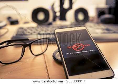 Smartphone In Office And Being Unable To Navigate Online.geo-blocking Concept.