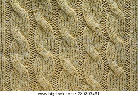 Knit Texture of Beige Wool Knitted Fabric with Cable Knits Pattern. Blank Background