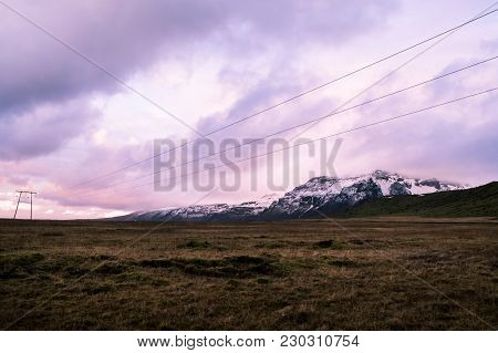 Purple Pink Skies And Snow Mountains In Iceland
