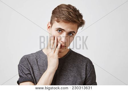 Close Up Picture Of Young Brunette Who Looks Tired And Unhappy. How Long Girlfriend Is Going To Stay