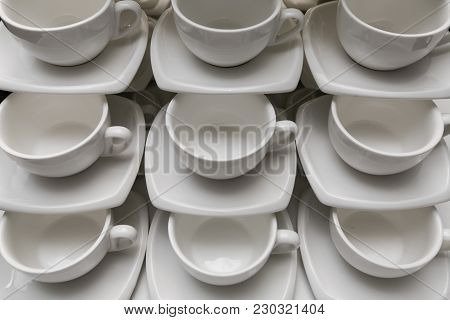 Many Rows Clean White Coffee Cup, Tea Spoon And Saucer On Table. Empty Mug Set In Row Prepare For Co