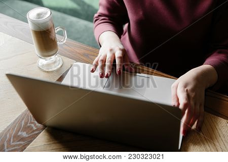 Female Working On Laptop In A Cafe. Woman Using Laptop In Home. Using Laptop Internet. Hand Using La