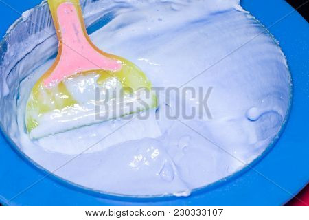 Hair Dye In Bowl And Brush For Hair Coloring.