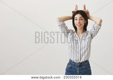 Girl Is All Ears To Hear Your New Excuses. Fashionable Feminine Caucasian Woman With Dark Hair Smili