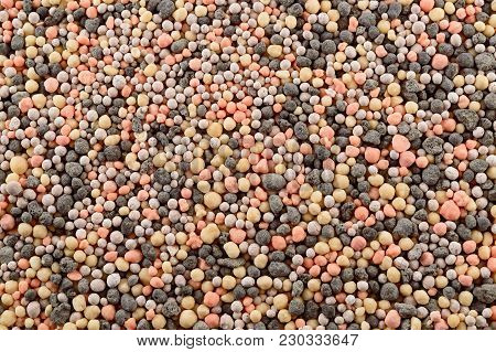 Multicolored Mineral Fertilizers Granules Closeup As Background