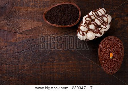 Chocolate Egg Ith Filling For Easter On Wooden Background