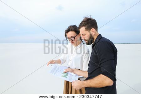 Landscape Designer Woman Come To Customer S New House To Show Sketches, People Standing Outdoors Dis