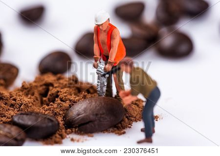 Miniature Figures Working On Coffee Macro Photography On White Background