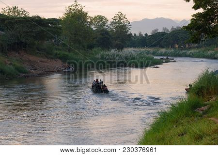 Myawadi, Myanmar - December 16, 2016: Morning On The Boundary Menammey River. Burmans By The Boat Ar