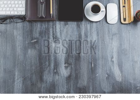 Top View Of Contemporary Wooden Desktop With Copy Space And Various Items. Work Place And Style Conc