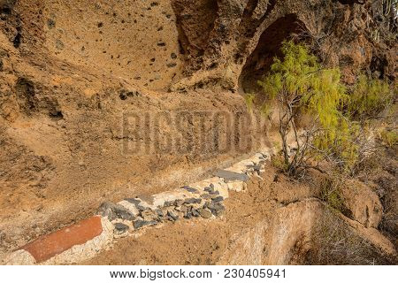 Irrigational Canal In Picturesque Rural Area With Open Watergate