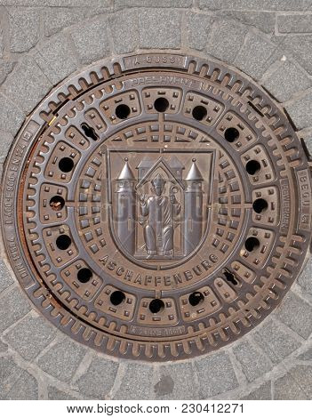 ASCAFFENBURG, GERMANY - JULY 07: Coat of Arms of Aschaffenburg on the manhole cover in Aschaffenburg, Germany on July 07, 2017.