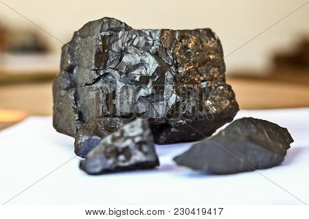 Close Up Of Manganese Ore Rock On A White Table