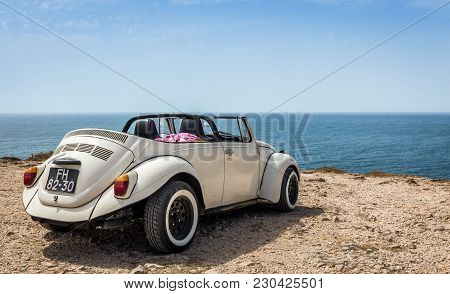 SAGRES, PORTUGAL - AUGUST 26, 2016: Classic cabrio car at Cape St. Vincent in Portugal
