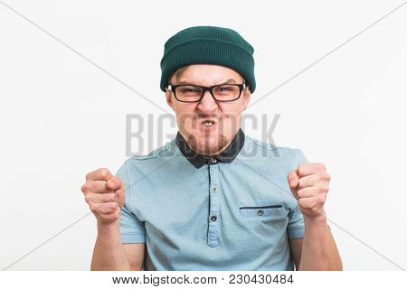 Portrait Of Young Angry Man On White Background.