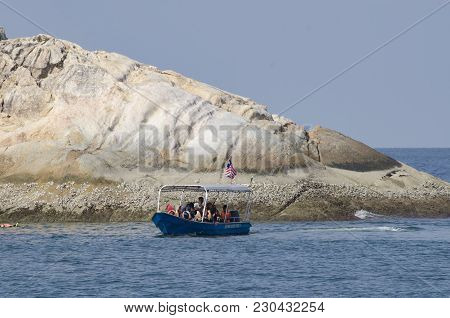 Pangkor Island, Malaysia - 17 December 2017 : Group Of Tourist Enjoy Exploring Pangkor Island Locate