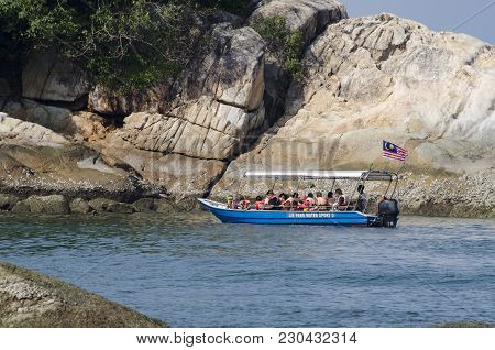 Pangkor Island, Malaysia - 17 December 2017 : Group Of Tourist Enjoy Exploring Pangkor Island Locate