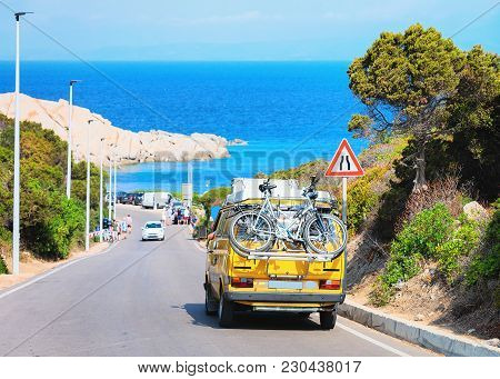 Van With Bicycle On The Road At Capo Testa, Santa Teresa Gallura, Sardinia, Italy