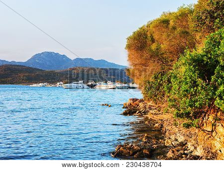 Sunrise With Yachts On Costa Smeralda At Mediterranean Sea, Sardinia, Italy