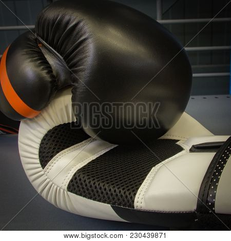 Two Boxing Gloves Lies On The Plank Of Boxing Ring, Close-up