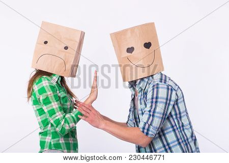 Disappointed Woman With Bags Over Heads Rejecting Her Boyfriend