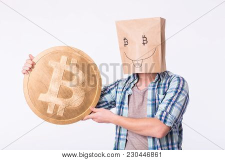 Golden Bitcoin In A Man Hand, Digitall Symbol Of A New Virtual Currency